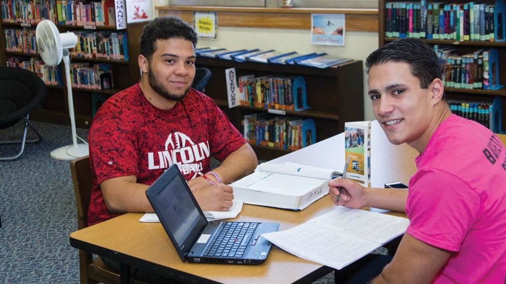 2 students sitting and studying 